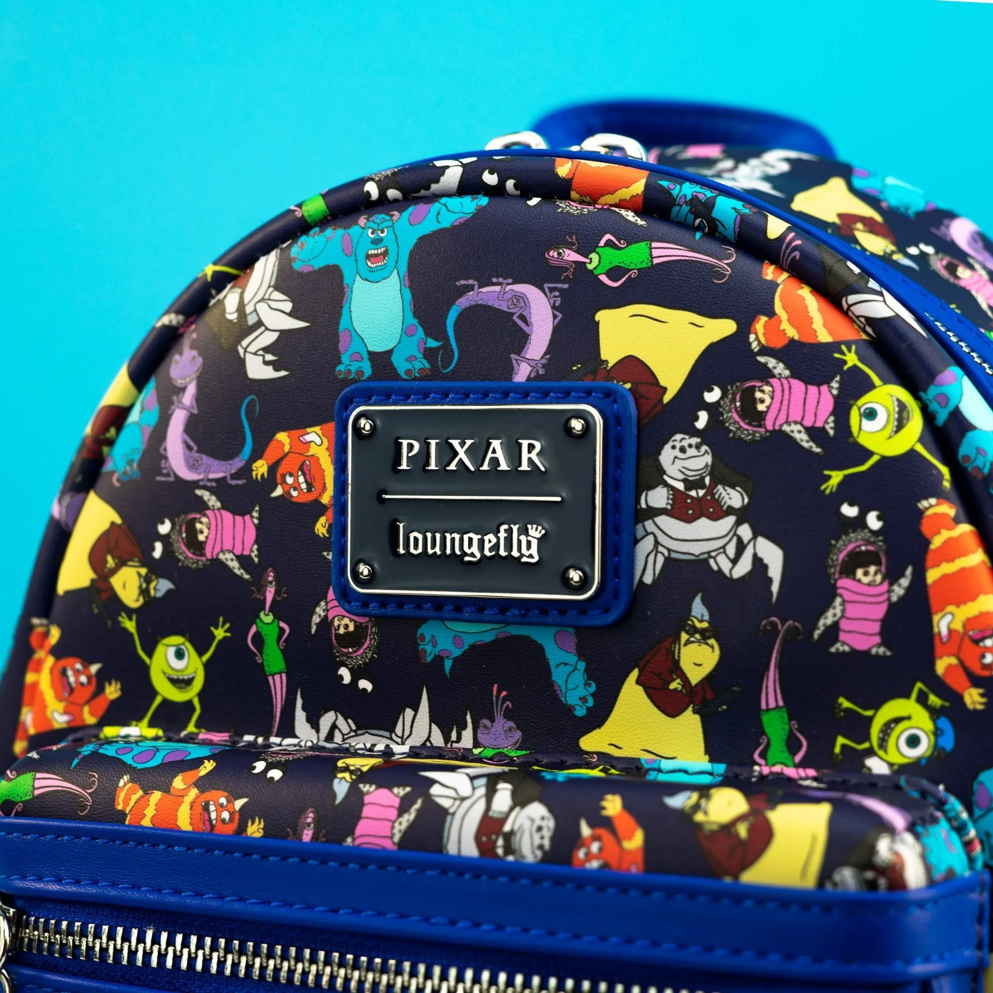 Loungefly x Disney Pixar Monsters Inc AOP Mini Backpack